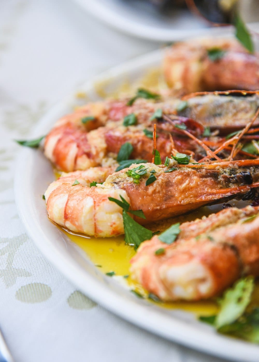 Grilled red prawns dressed with oil and herbs