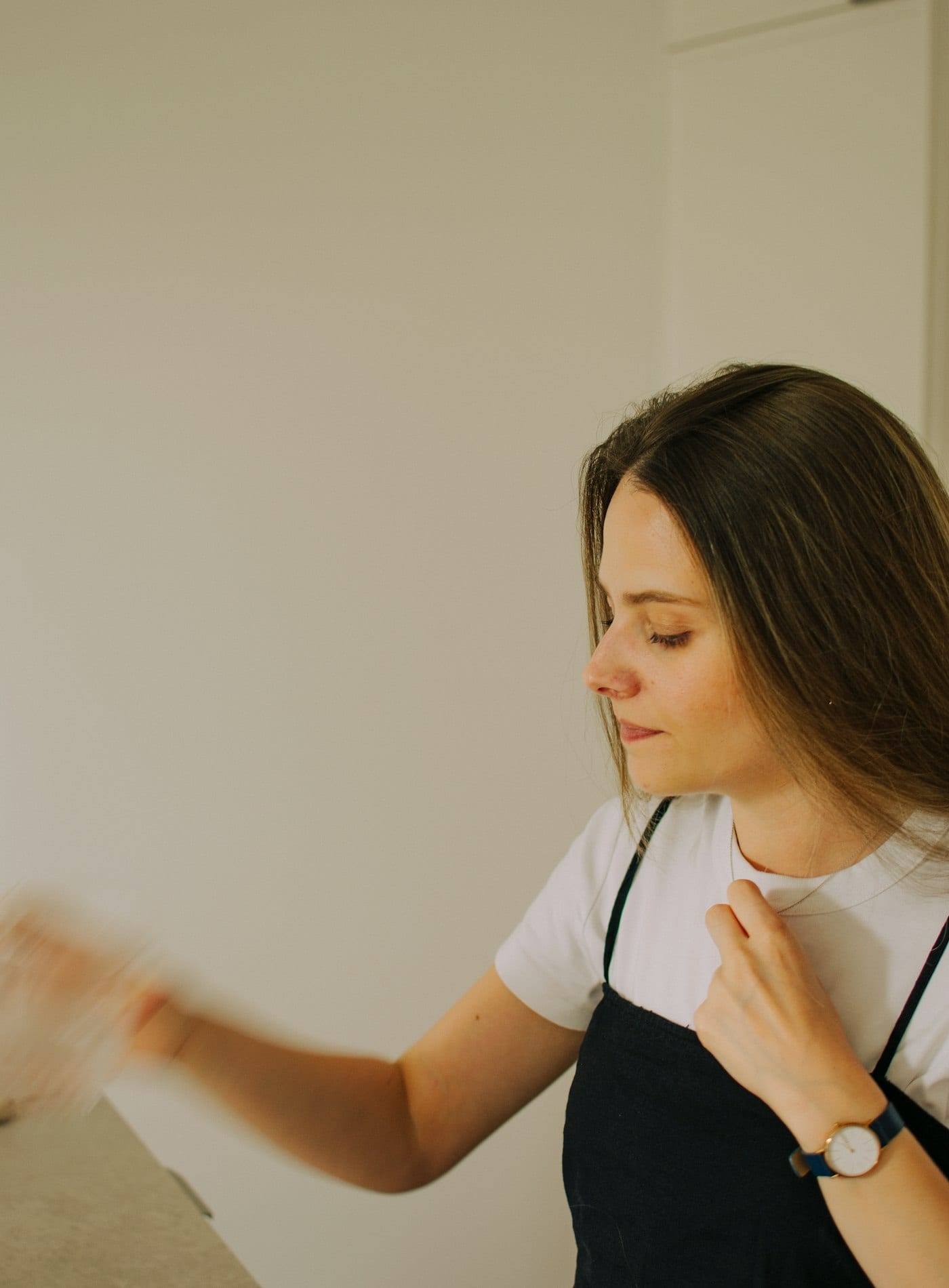 Chef Elena Vitali in an apron, in soft daylight